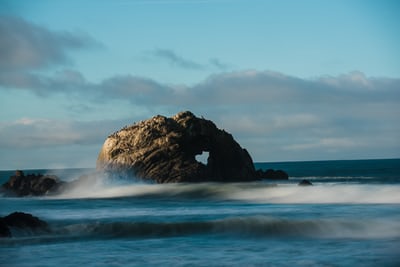 view of large rock in ocean in long beach