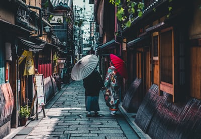 narrow street with vendors in tokyo japan
