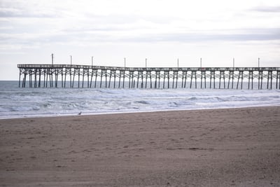 dock extending out into the ocean in greensboro north carolina usa.