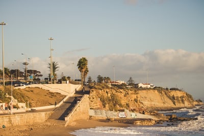 ocean shoreline with steps from the ocean in lisbon portugal