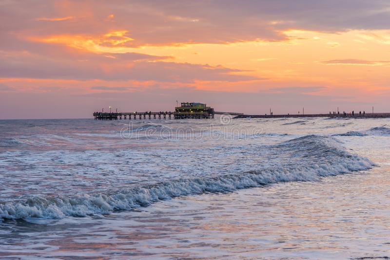 gentle ocean waves with view of dock in galveston texas.