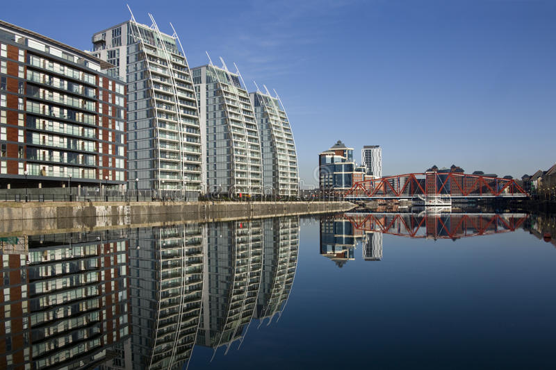 view of city buildings by the water in manchester united kingdom.